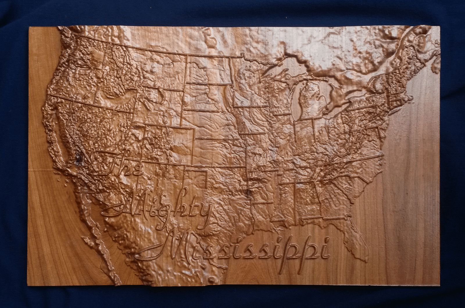 Picture of carved map of the United States showing the Mississippi River's extents